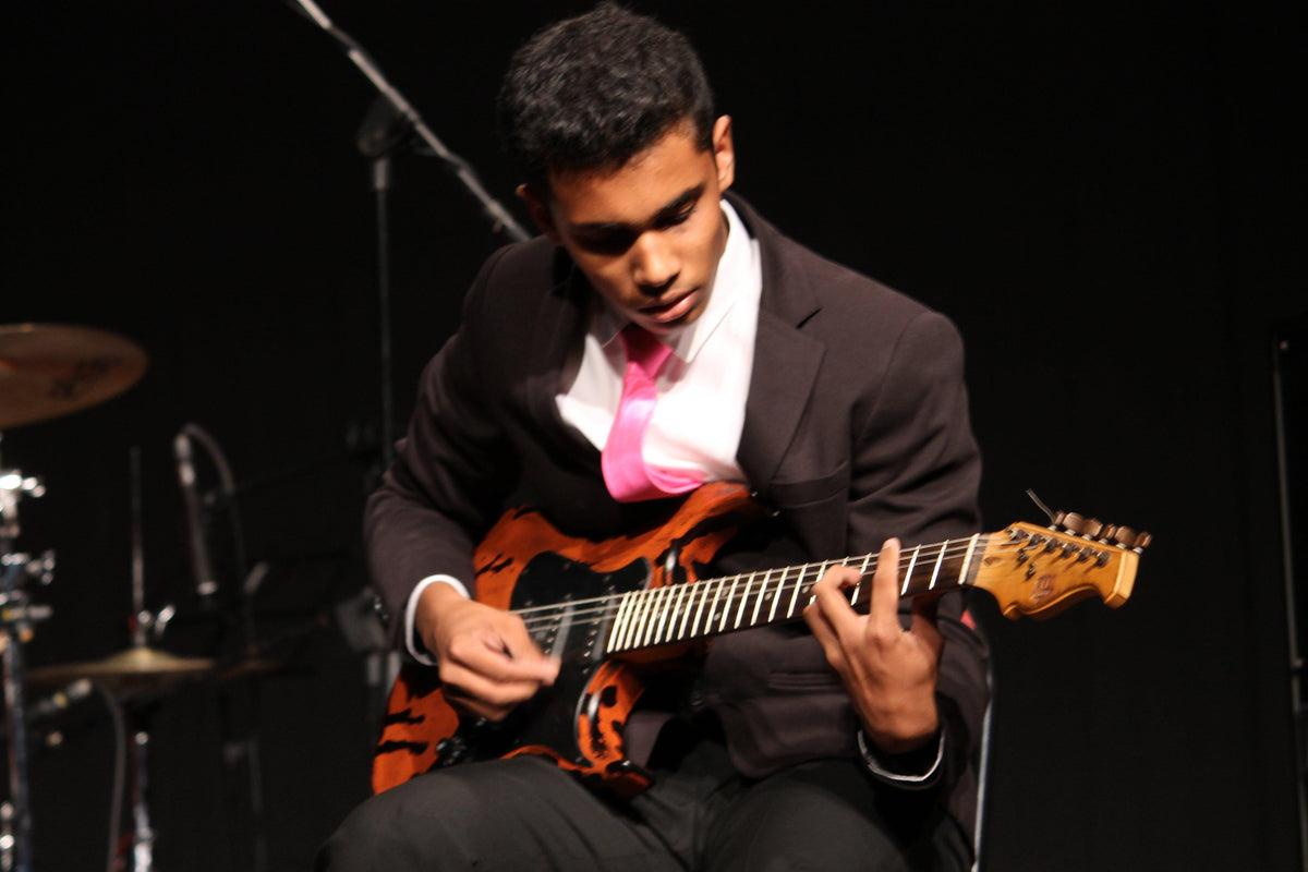 Guitar student performing at Aurzart Music Academy in Bangalore