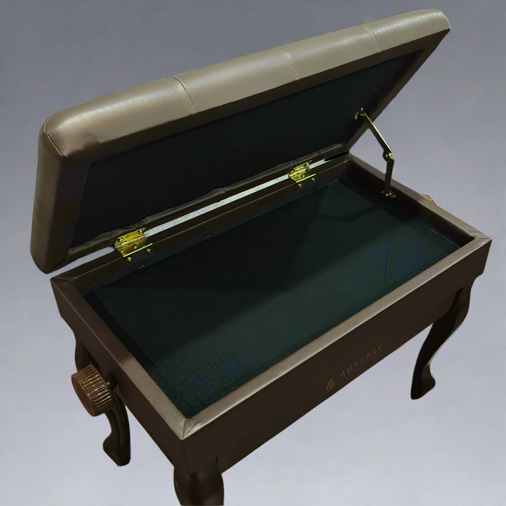 Wooden piano with open lid on a wooden floor, showing brand name 'Camon'.